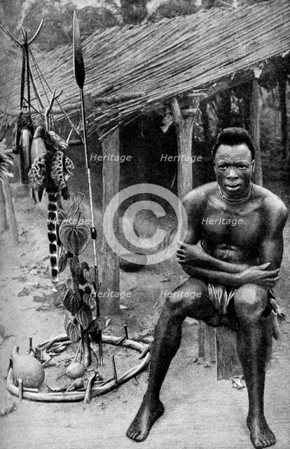 A witch doctor, Belgian Congo (Congo Republic), 1922.Artist: JH Harris