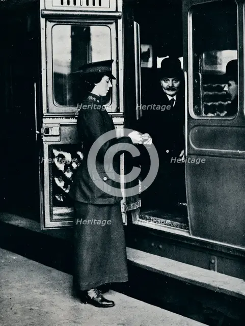A woman ticket inspector at work, c1914. Artist: Unknown