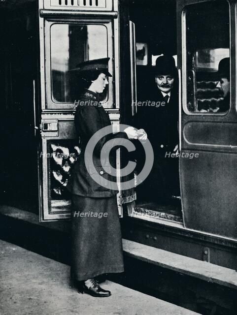 A woman ticket inspector at work, c1914. Artist: Unknown