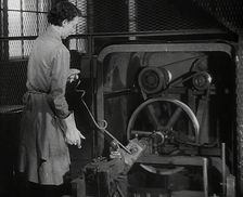 A Woman Using Factory Machinery, 1942. Creator: British Pathe Ltd