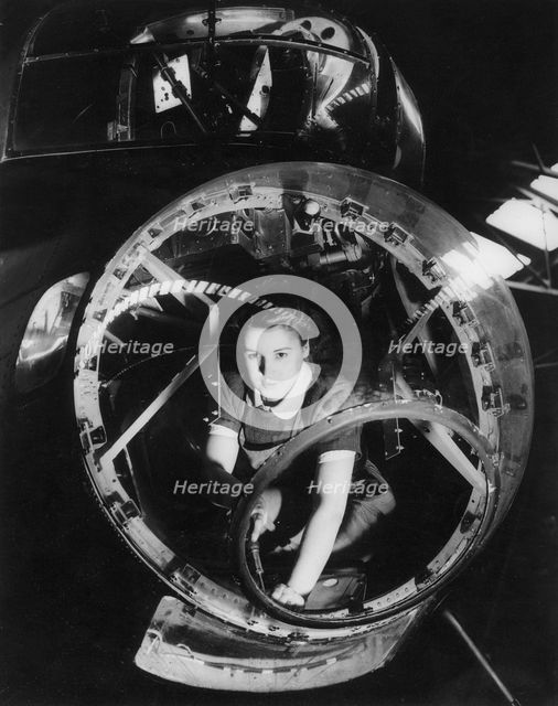 A woman working on a Lancaster bomber, Second World War, 1940s. Artist: Unknown