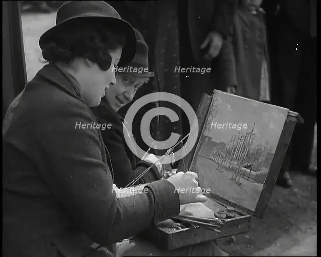A Woman Artist Sitting at the Side of the Mall Painting the Scene While Watched By Several..., 1937. Creator: British Pathe Ltd.