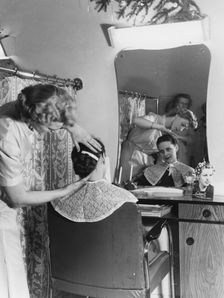 A woman at the hairdresser's, Sweden. Creator: Unknown