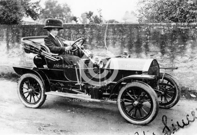 A woman at the wheel of an 8hp Humber, 1909. Artist: Unknown