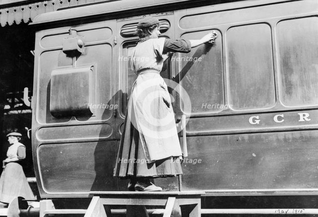 A woman cleaning railway carriages at Marylebone station, April 1915. Creator: Unknown.