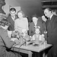 A woman demonstrates a sewing machine, Landskrona, Sweden, 1951. Creator: Unknown