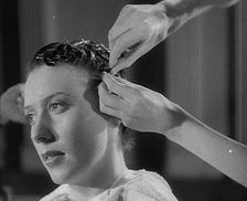 A Woman Having Her Hair Cut in the Victory Style, 1942. Creator: British Pathe Ltd