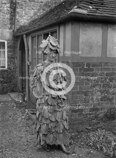 A woman in a cabbage leaf costume, Hellidon, Northamptonshire, c1896-c1920. Artist: A Newton