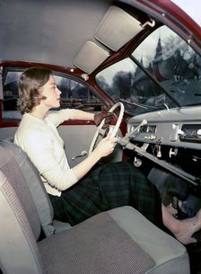 A woman in a Saab 92 car, Sweden, 1952-1953. Creator: Göran Algård