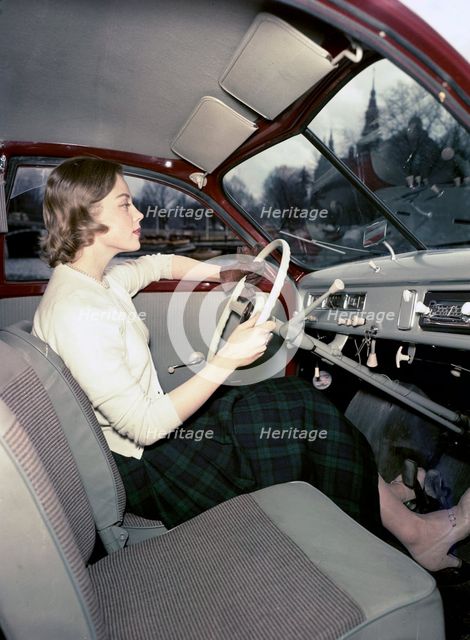 A woman in a Saab 92 car, Sweden, 1952-1953. Creator: Göran Algård.