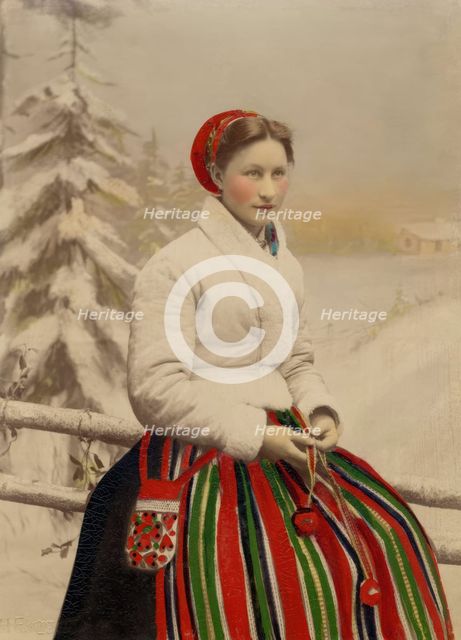 A woman in folk costume and white fur-trimmed jacket, 1886-1920. Creator: Helene Edlund.