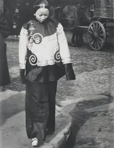 A woman in holiday attire, Chinatown, San Francisco, between 1896 and 1906. Creator: Arnold Genthe