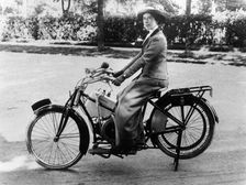 A woman on a Douglas motorbike, (c1913?)