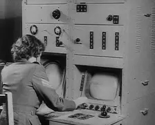 A Woman Operating a Radio, 1940. Creator: British Pathe Ltd