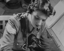 A Woman Operating a Radio, 1940. Creator: British Pathe Ltd