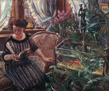A Woman Reading near a Goldfish Tank, 1911. Creator: Corinth, Lovis (1858-1925)
