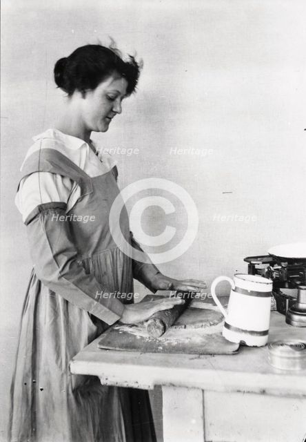 A woman rolls pastry, Rowntree’s factory, York, Yorkshire, 1920. Artist: Unknown