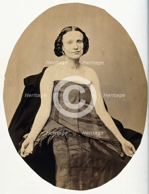 A woman seated; she is partially clothed with her arms extended and the left side of her..., c1865. Creator: L. Haase & Company.