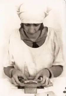 A woman seals the wrapper of a tube of Rowntree clear gums, Rowntree factory, York, 1929