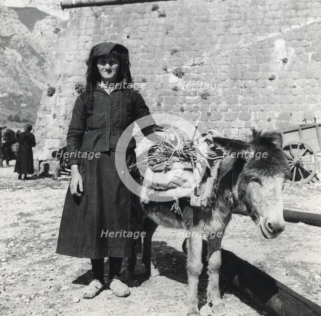 A women and her donkey, Montenegro, Yugoslavia, 1939. Artist: Unknown