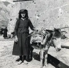 A women and her donkey, Montenegro, Yugoslavia, 1939. Creator: Unknown