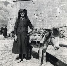 A women and her donkey, Montenegro, Yugoslavia, 1939. Creator: Unknown