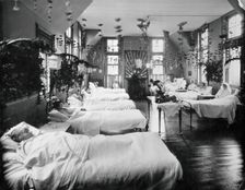 A women's ward in an unidentified hospital, with elaborate decorations. Creator: Unknown