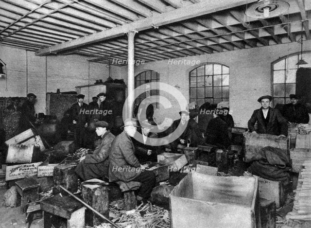 A wood-chopping workshop, London, 1926-1927. Artist: Unknown
