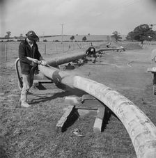 A worker carrying out guniting (spraying concrete) on the Mersey oil pipeline..., 24/09/1967. Creator: John Laing plc