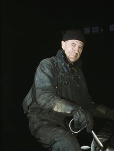 A worker in the roundhouse at the C & NW RR., Proviso yard, Chicago, Ill., 1942. Creator: Jack Delano