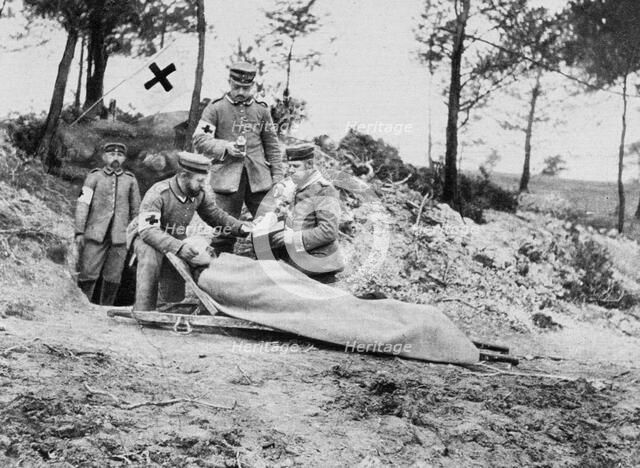 A wounded German soldier at a dressing station, World War I, 1915. Artist: Unknown