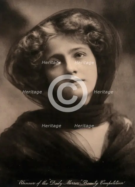 A young woman, winner of a beauty contest, wearing a large black hat with a trailing scarf..., c1904 Creator: Unknown.