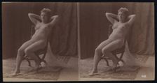 A young woman posing naked but for a long veil, leaning back in a chair, in a photographic..., c1900 Creator: Unknown