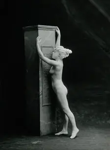 A young woman, posing naked in a classical attitude, against a square column..., c1890/1910. Creator: Unknown