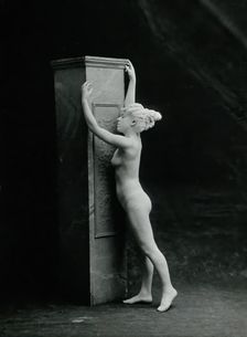 A young woman, posing naked in a classical attitude, against a square column..., c1890/1910. Creator: Unknown