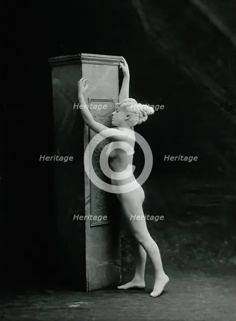 A young woman, posing naked in a classical attitude, against a square column..., c1890/1910. Creator: Unknown.