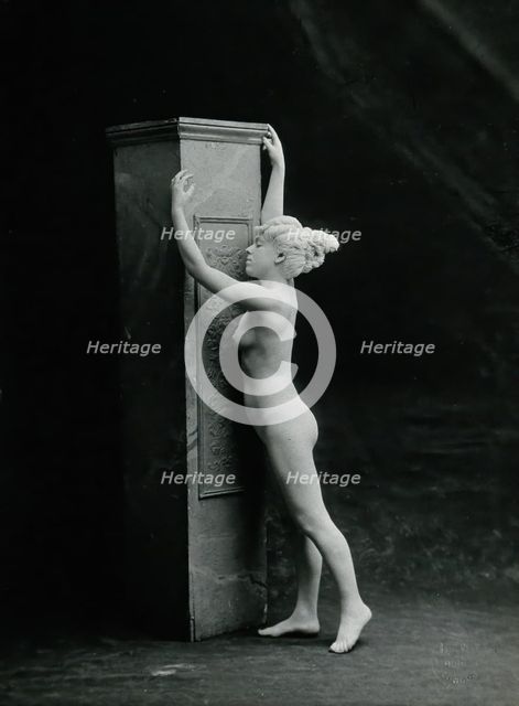 A young woman, posing naked in a classical attitude, against a square column..., c1890/1910. Creator: Unknown.