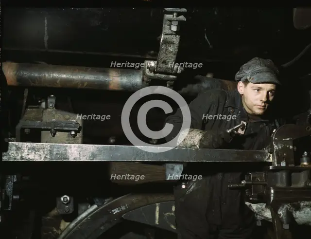 A young worker at the C & NW RR 40th Street shops, Chicago, Ill., 1942. Creator: Jack Delano.
