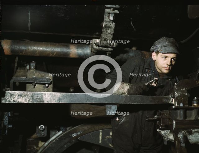 A young worker at the C & NW RR 40th Street shops, Chicago, Ill., 1942. Creator: Jack Delano.