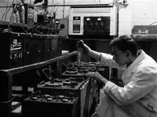 A young apprentice at Globe & Simpson auto electricians workshop, Lincoln, Lincolnshire, 1961. Creator: Michael Walters
