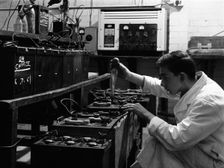 A young apprentice at Globe & Simpson auto electricians workshop, Lincoln, Lincolnshire, 1961. Artist: Michael Walters
