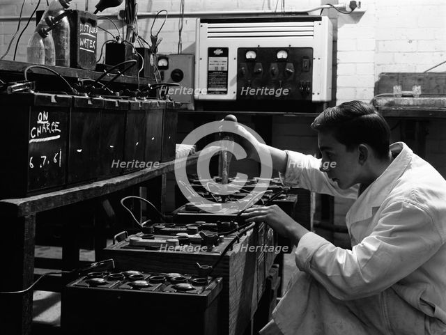 A young apprentice at Globe & Simpson auto electricians workshop, Lincoln, Lincolnshire, 1961. Artist: Michael Walters