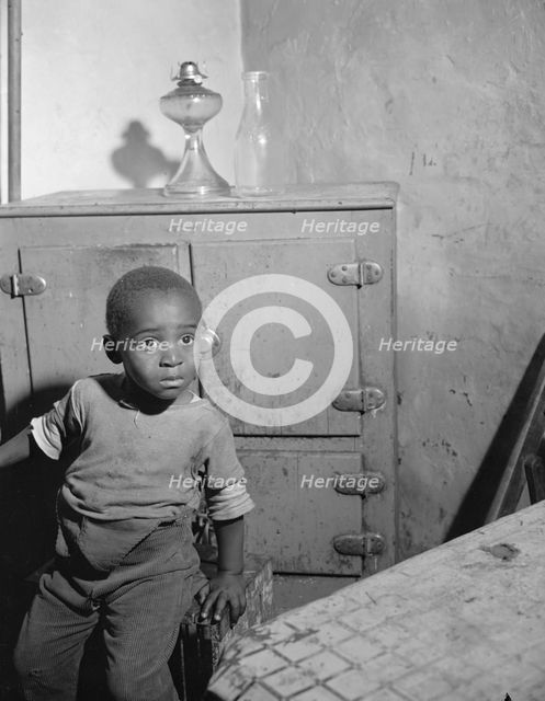 A young boy who lives near the nation's capitol, Washington, D.C., 1942. Creator: Gordon Parks.