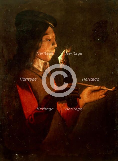 A young boy with a pipe, blowing on a firebrand (Le Souffleur à la pipe). Creator: La Tour, Georges de, (Circle) (1583-1652).