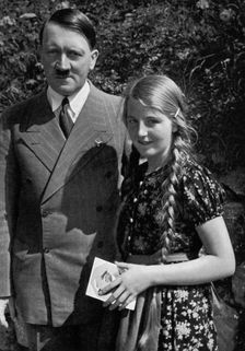 A young girl asks Adolf Hitler for his autograph, 1936