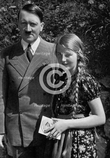 A young girl asks Adolf Hitler for his autograph, 1936. Artist: Unknown