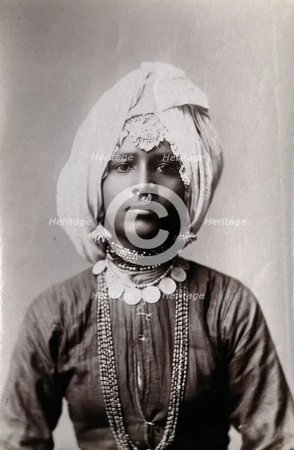 A young Hindu girl, perhaps a princess, in a studio setting, c1900. Creator: Unknown.