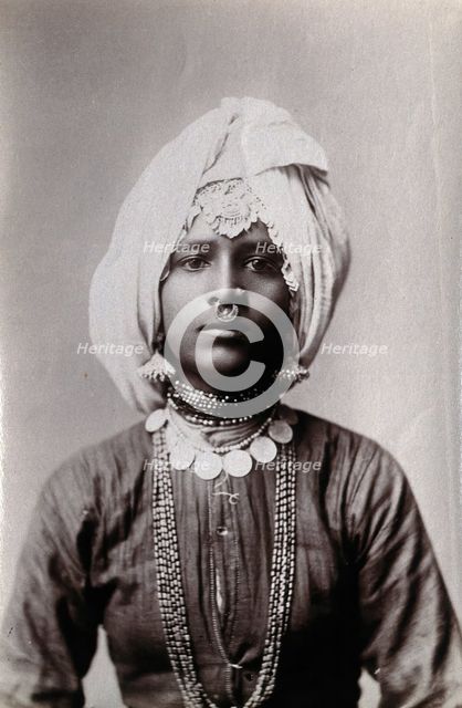 A young Hindu girl, perhaps a princess, in a studio setting, c1900. Creator: Unknown.