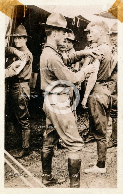 A young man getting a shot in the arm, Fort Sheridan, Illinois, USA, 1920. Artist: Unknown