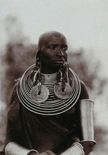 A young Masai woman, wearing much jewellery, approx 1900. Creator: Unknown